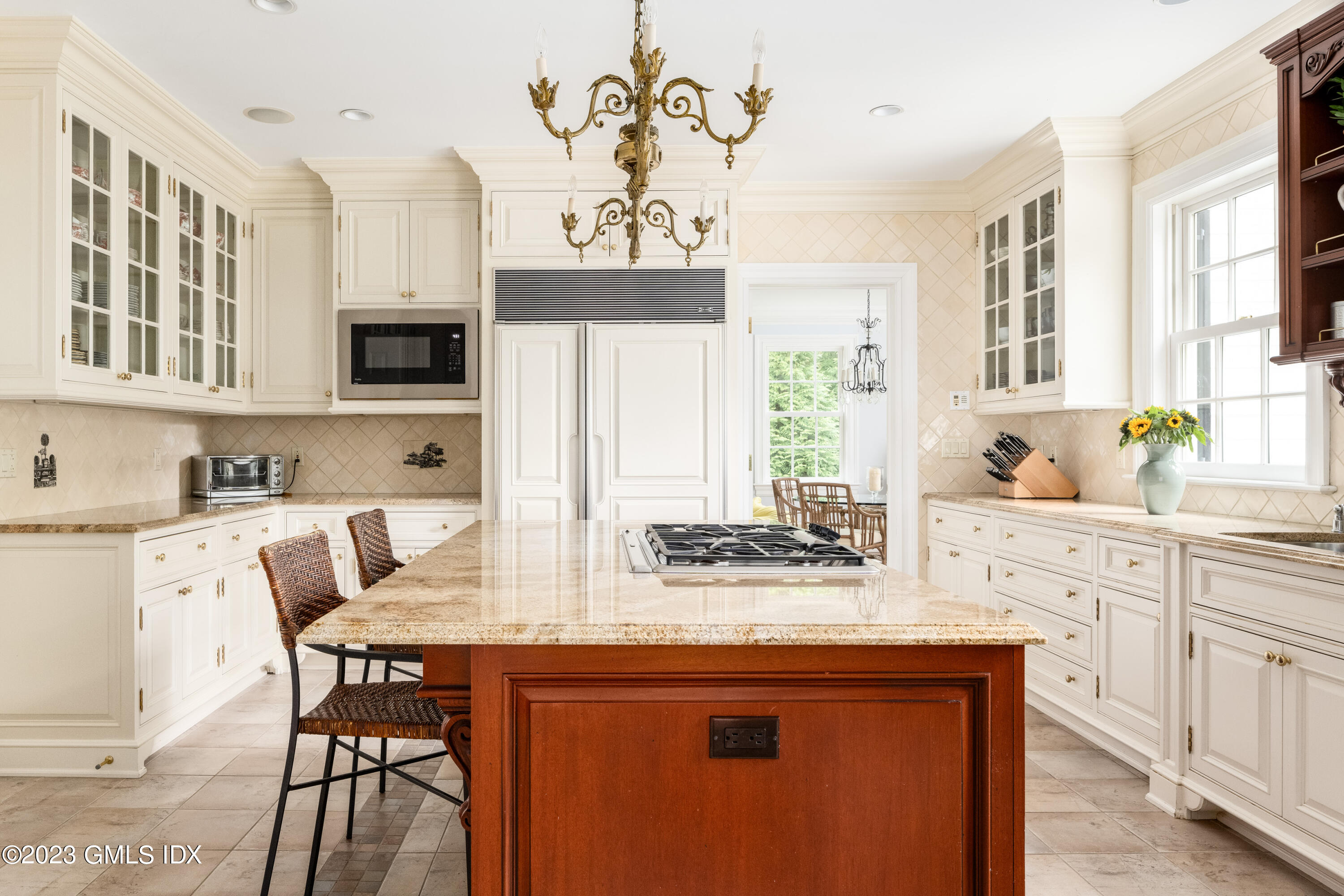 6 Hill Road Greenwich, CT 06830 - Photo 9 of 35 a kitchen with kitchen island granite countertop a sink cabinets and window