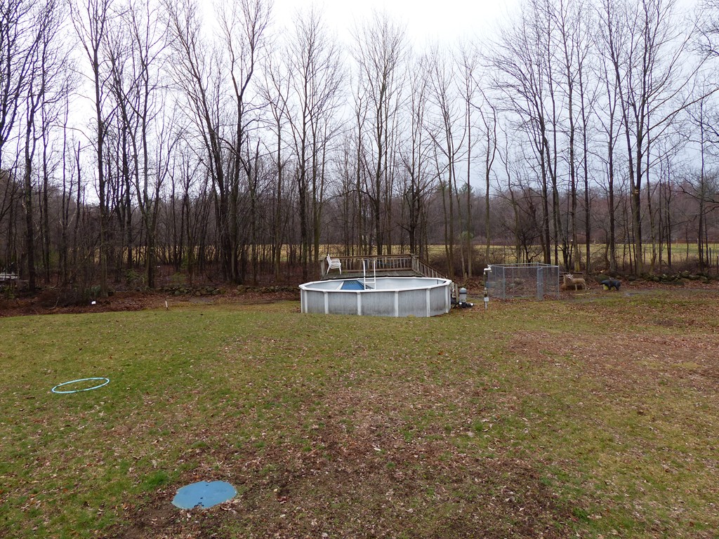 86 Highland Road Merrimac, MA 01860 - Photo 4 of 12 a backyard of a house with lots of green space