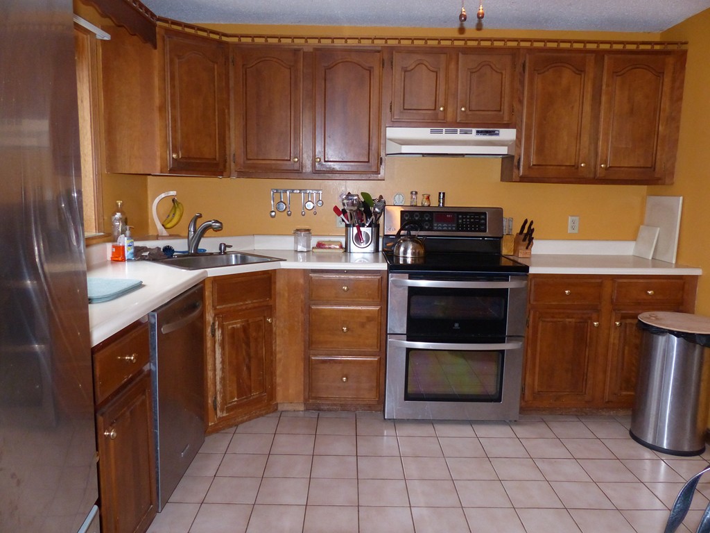 86 Highland Road Merrimac, MA 01860 - Photo 5 of 12 a kitchen with a stove sink and cabinets