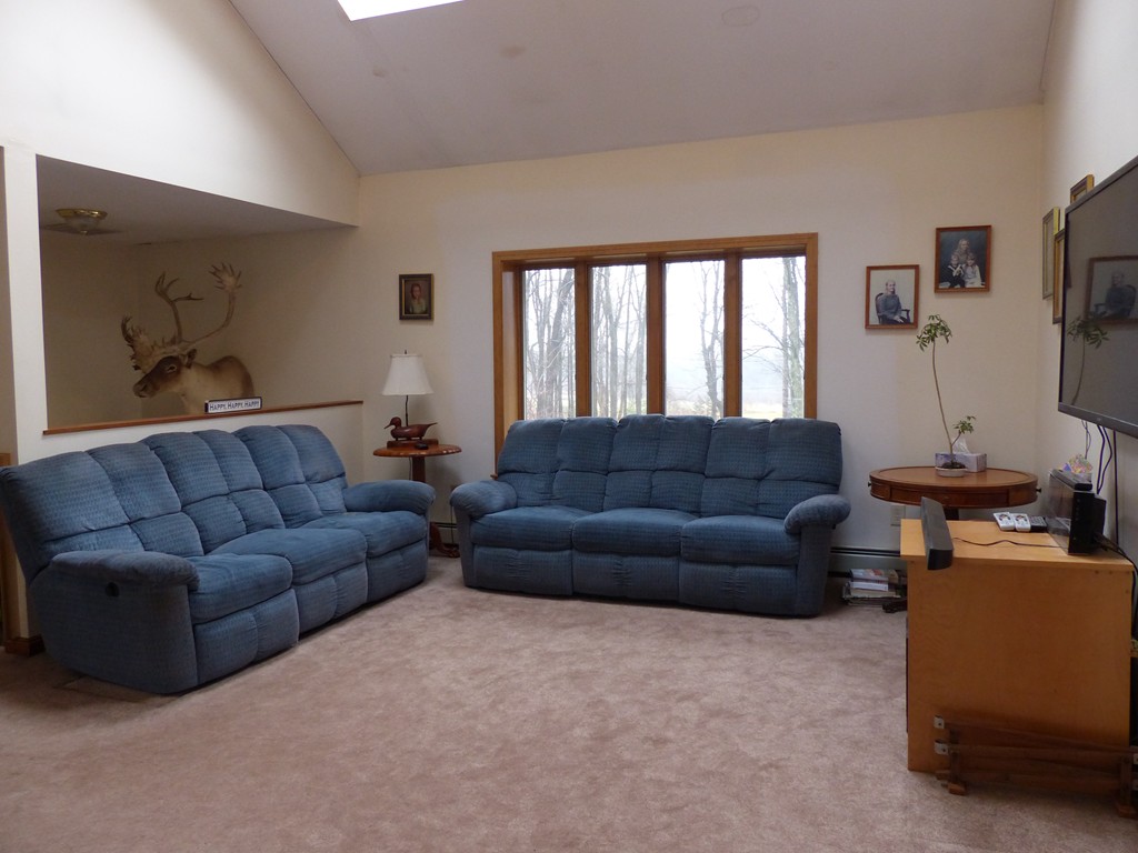 86 Highland Road Merrimac, MA 01860 - Photo 8 of 12 a living room with furniture and a flat screen tv