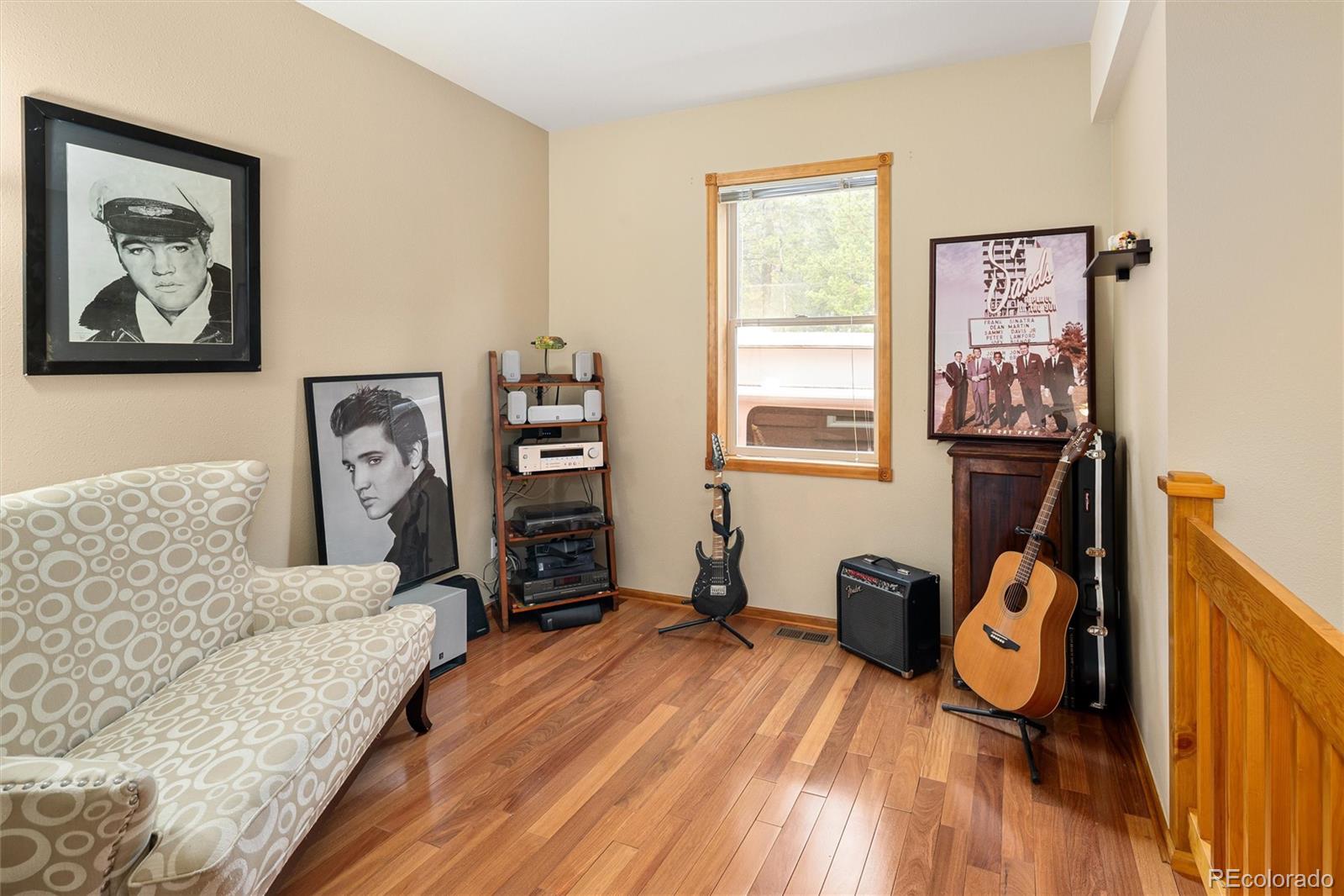 11163 Conifer Mountain Road Conifer, CO 80433 - Photo 11 of 46 a view of a livingroom with furniture and wooden floor