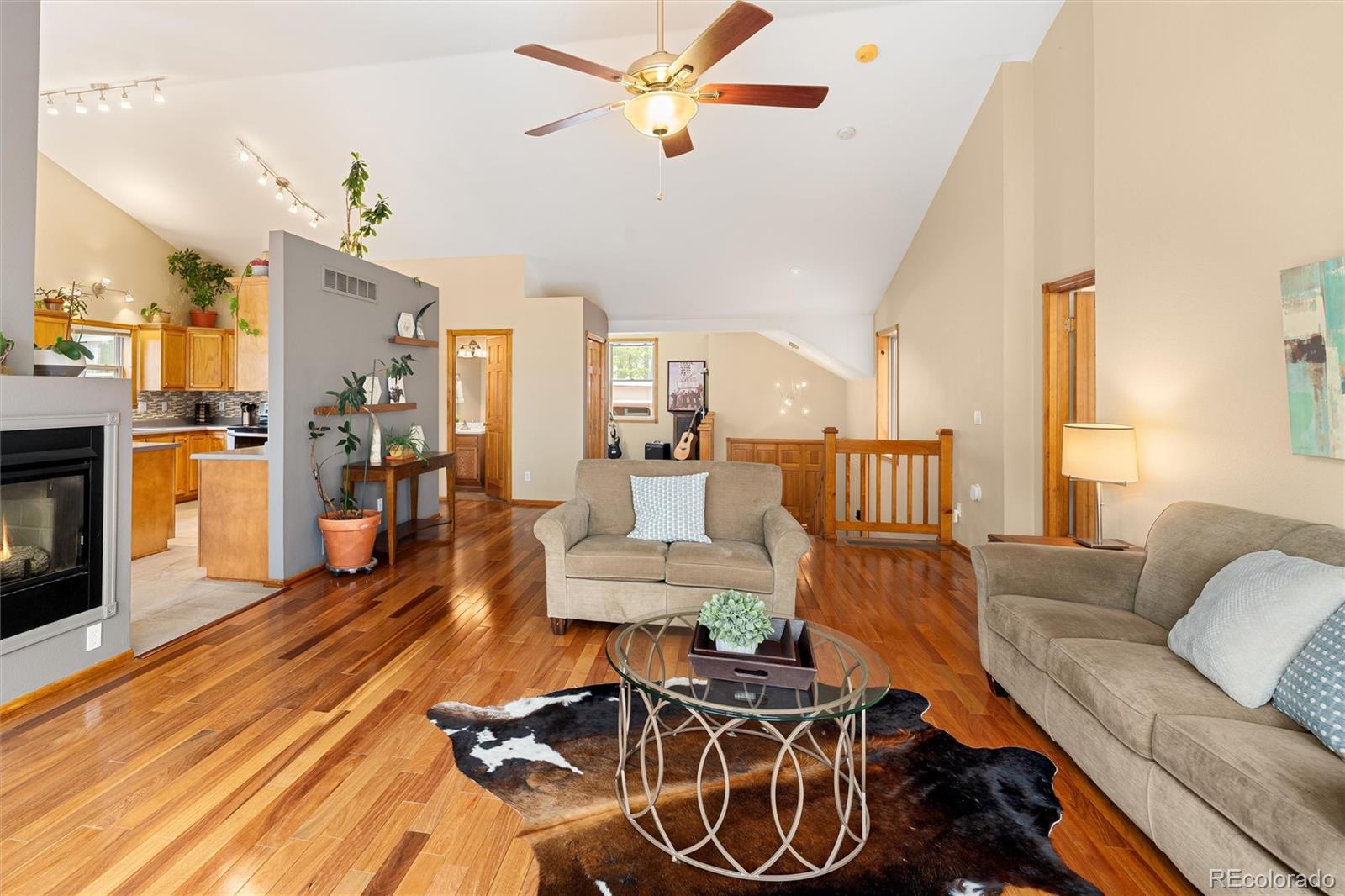 11163 Conifer Mountain Road Conifer, CO 80433 - Photo 15 of 46 a living room with furniture and kitchen view