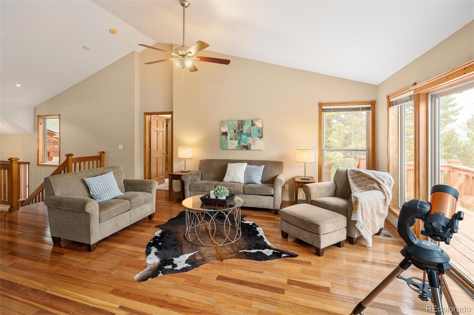 11163 Conifer Mountain Road Conifer, CO 80433 - Photo 16 of 46 a living room with furniture large window and a table