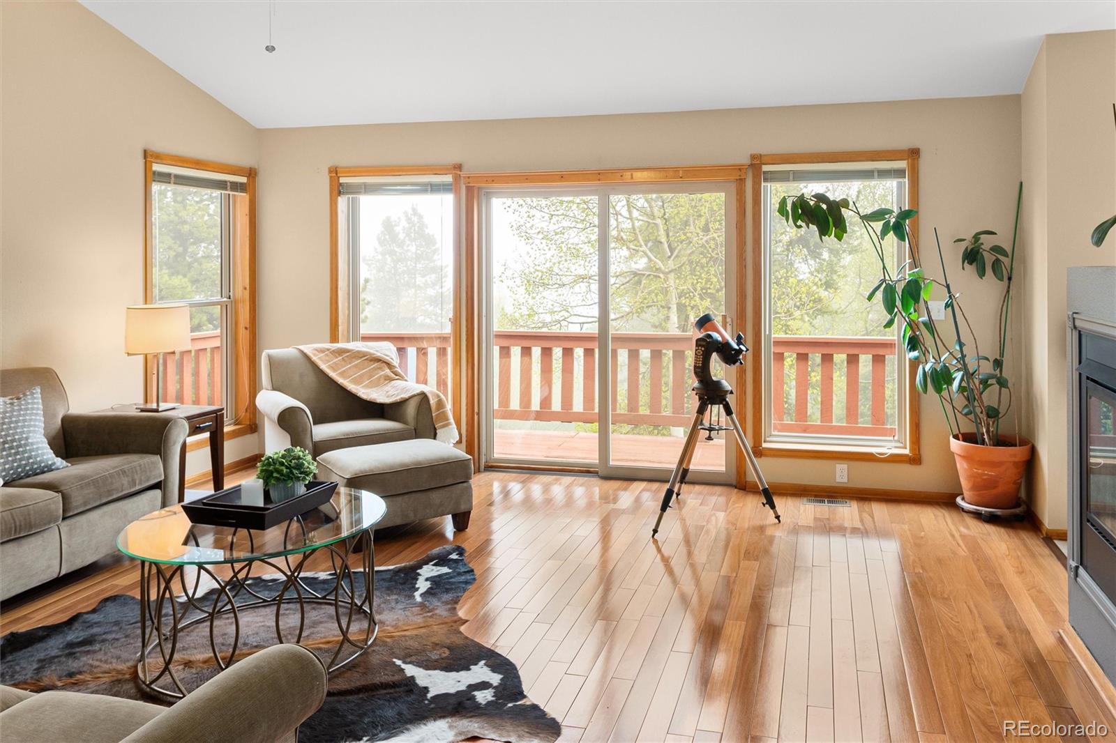 11163 Conifer Mountain Road Conifer, CO 80433 - Photo 17 of 46 a living room with furniture and a large window