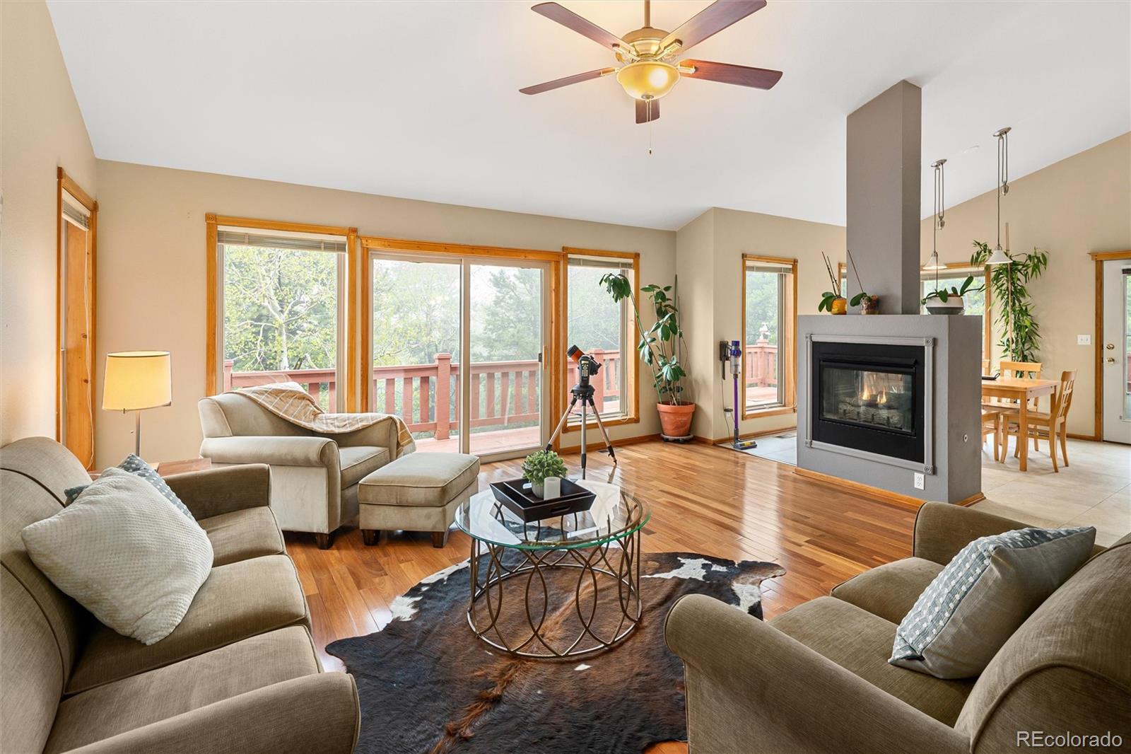 11163 Conifer Mountain Road Conifer, CO 80433 - Photo 3 of 46 a living room with furniture or fireplace and a large window