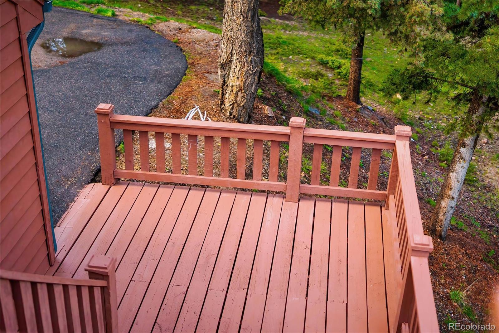 11163 Conifer Mountain Road Conifer, CO 80433 - Photo 35 of 46 a view of balcony with wooden floor
