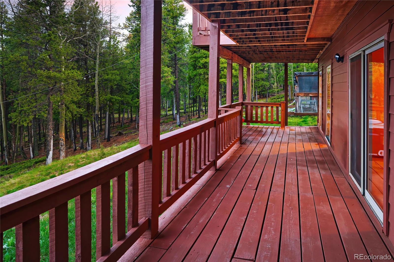 11163 Conifer Mountain Road Conifer, CO 80433 - Photo 36 of 46 a view of balcony with wooden floor