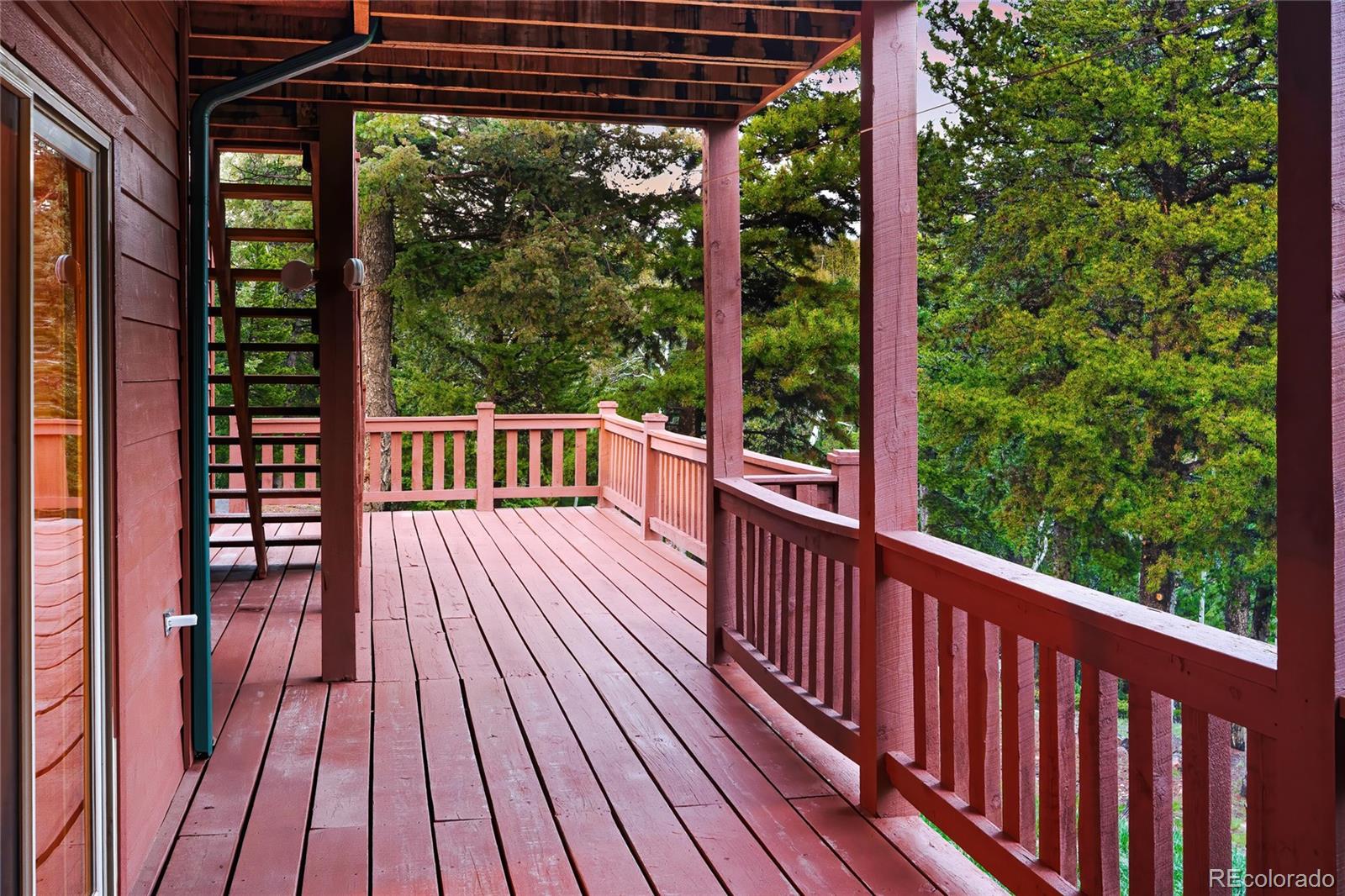 11163 Conifer Mountain Road Conifer, CO 80433 - Photo 37 of 46 a view of a balcony with wooden floor