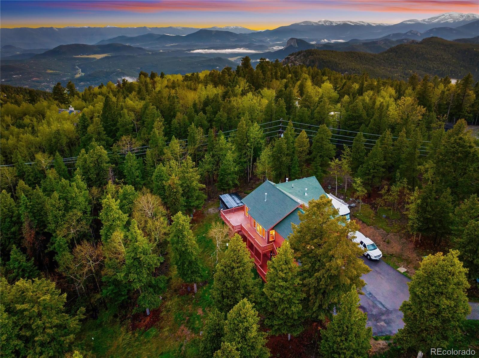 11163 Conifer Mountain Road Conifer, CO 80433 - Photo 5 of 46 a view of a mountain with a lake