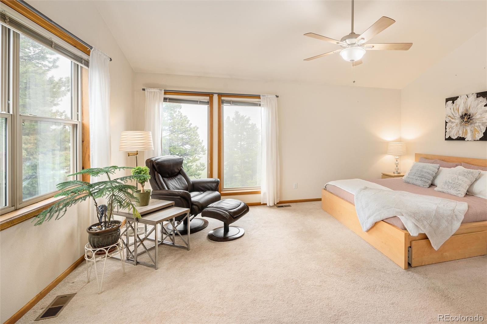 11163 Conifer Mountain Road Conifer, CO 80433 - Photo 7 of 46 a living room with furniture and a large window