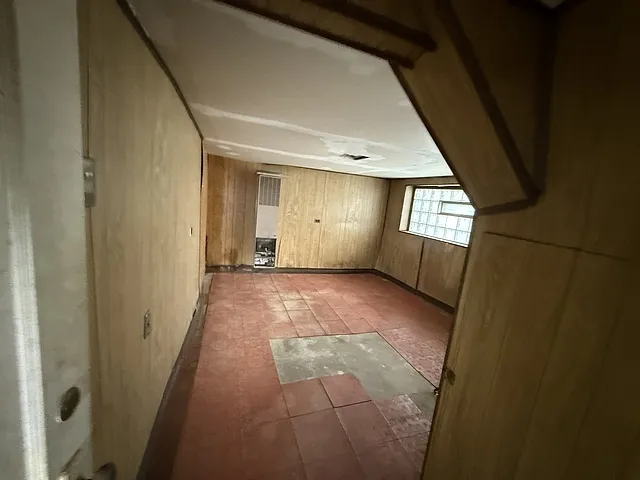 a view of hallway with window and entryway