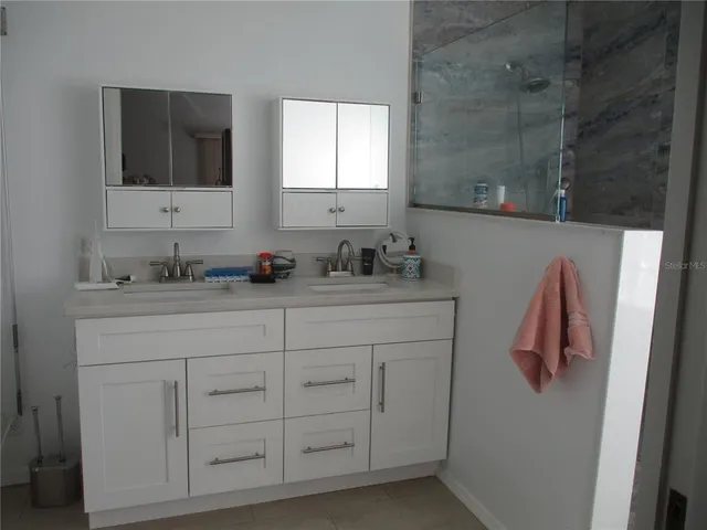 a bathroom with a sink and a mirror