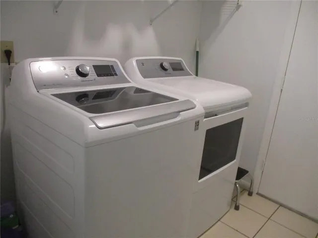 a utility room with dryer and washer