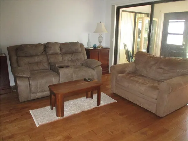 a living room with furniture and a window