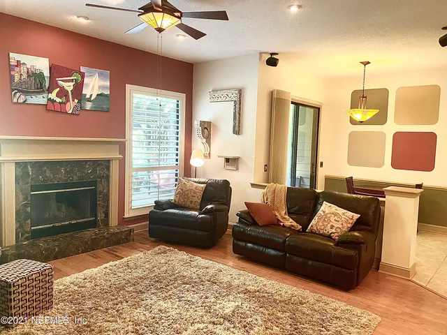 a living room with furniture and a fireplace