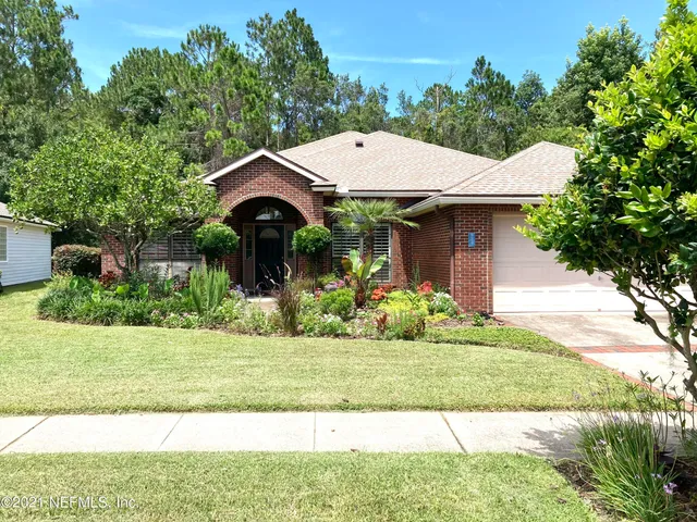 a backyard of a house with lots of green space
