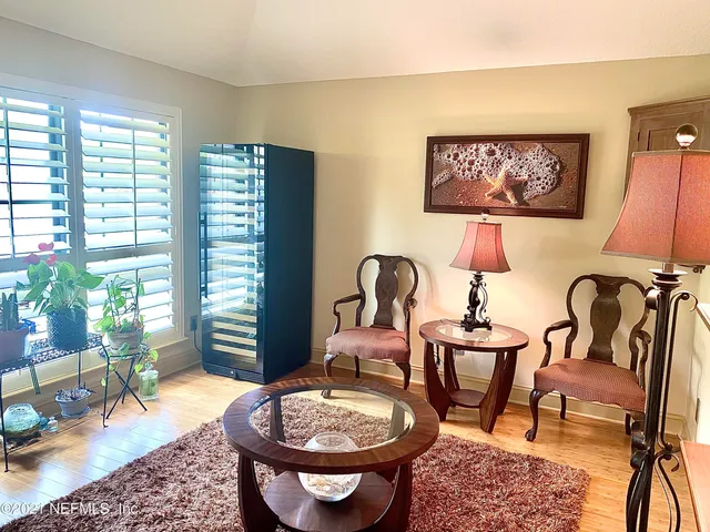 a room with furniture and a potted plant