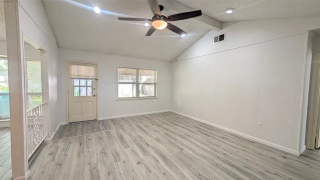 a view of a bedroom with a sink and a window