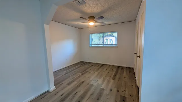 a view of a patio with table and chairs a barbeque with wooden fence