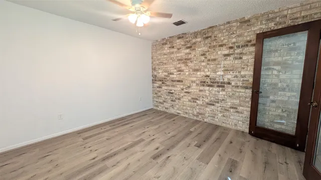 a kitchen with a sink appliances and cabinets
