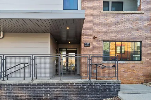 a kitchen with granite countertop lots of counter top space and stainless steel appliances