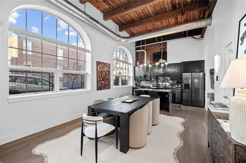 a bedroom with a bed and a mirror