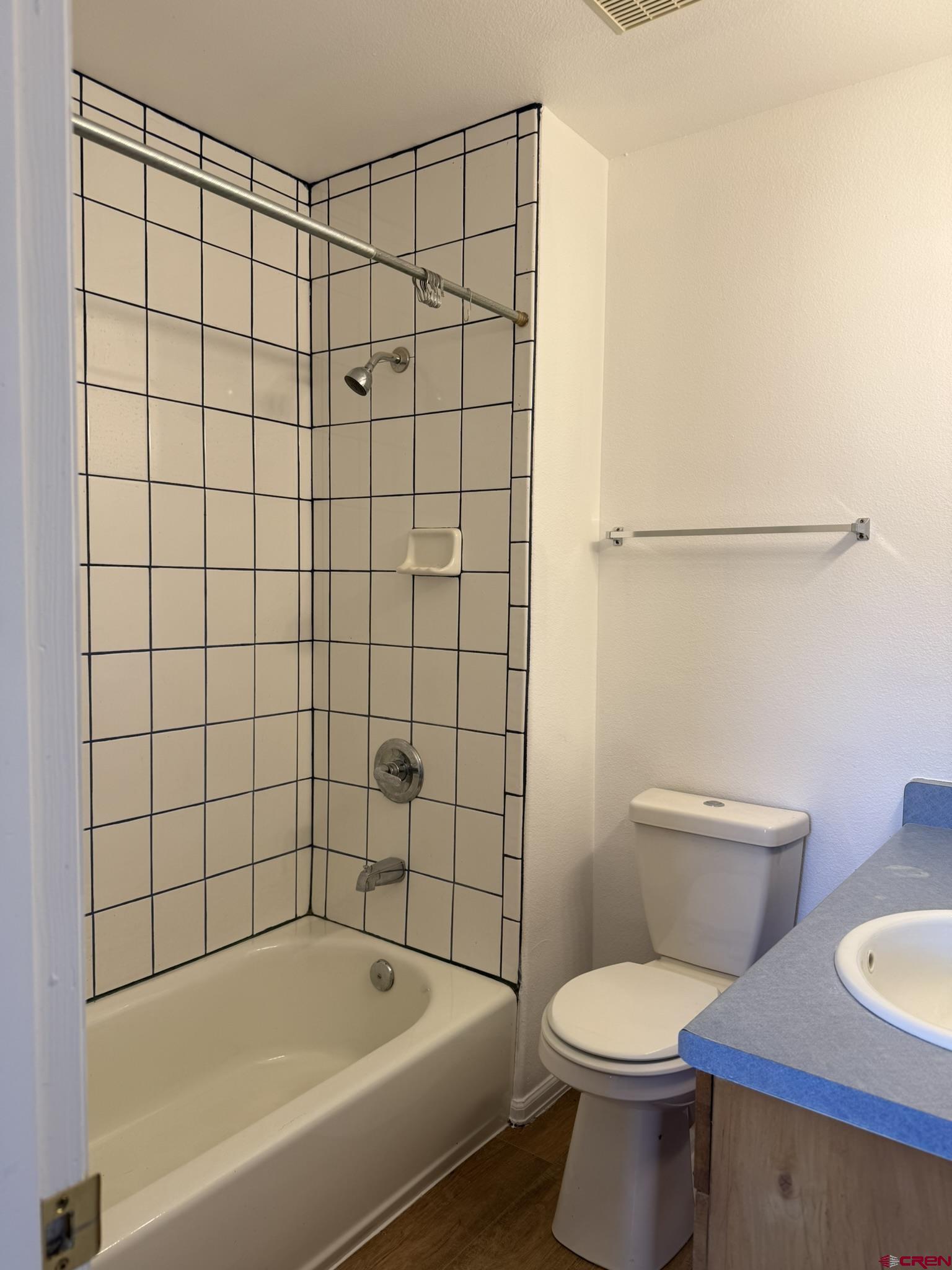 18358 Surface Creek Road Cedaredge, CO 81413 - Photo 12 of 26 a bathroom with a toilet and bathtub