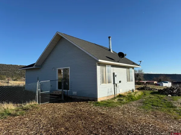 a backyard of a house with lots of green space