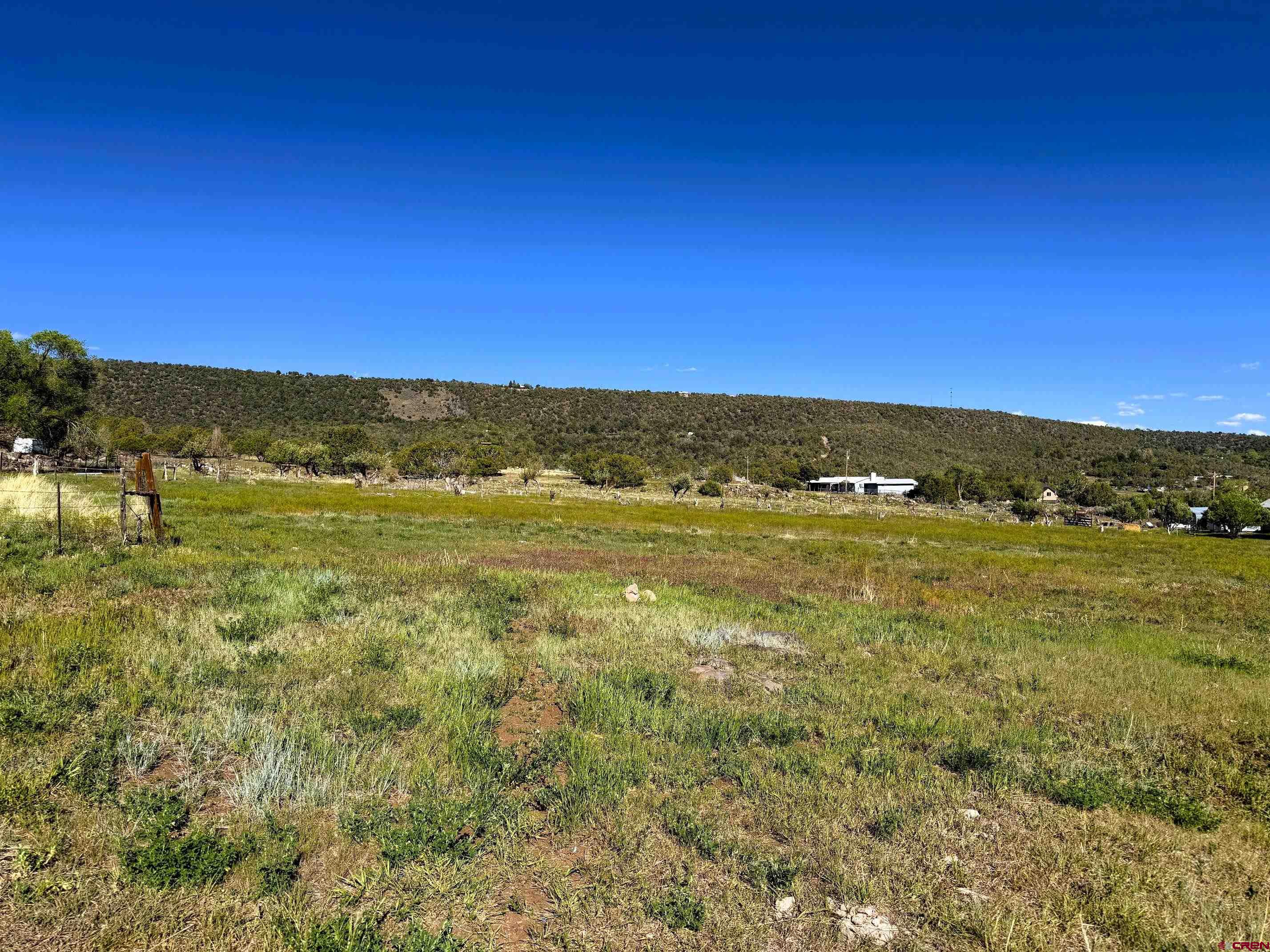 18358 Surface Creek Road Cedaredge, CO 81413 - Photo 18 of 26 a view of an ocean and a mountain