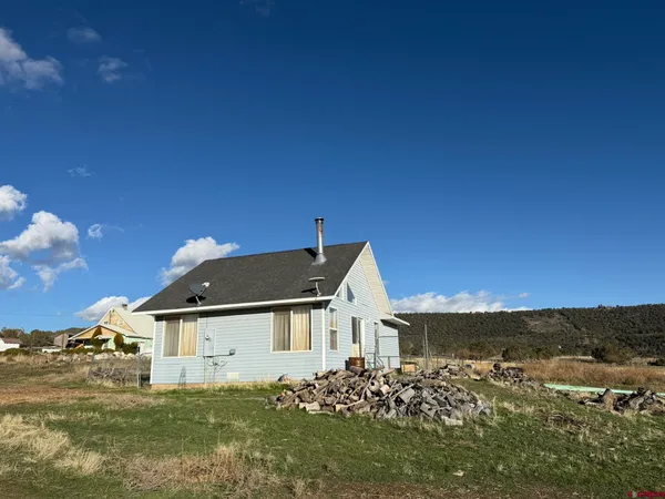 a view of a house with a big yard