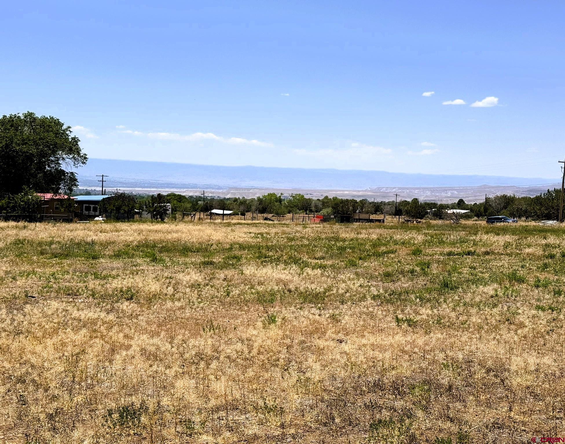 18358 Surface Creek Road Cedaredge, CO 81413 - Photo 26 of 26 a view of an ocean beach and a mountain view