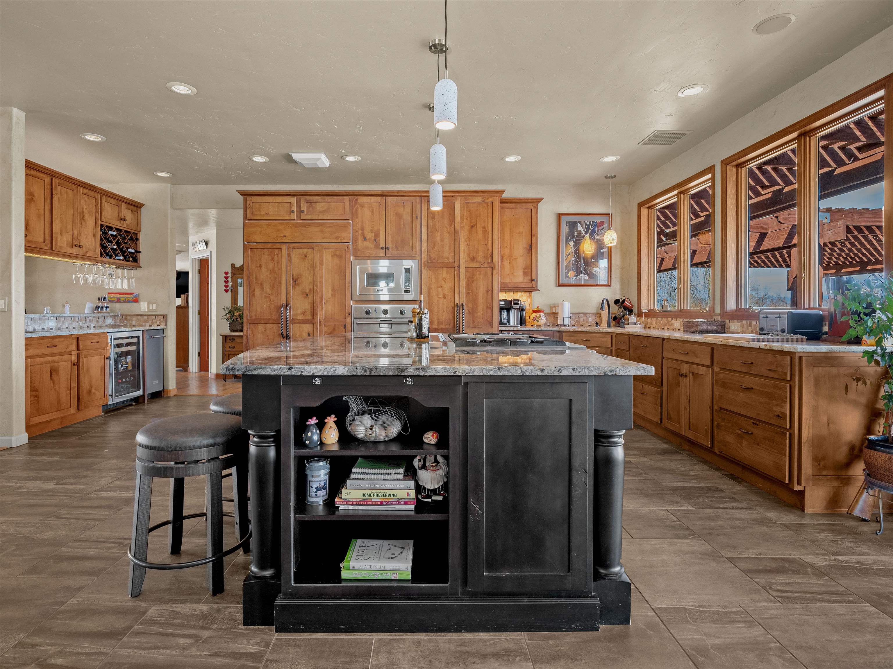 2111 Desert Hill Road Grand Junction, CO 81507 - Photo 12 of 34 a kitchen with stainless steel appliances granite countertop a stove a sink and a refrigerator