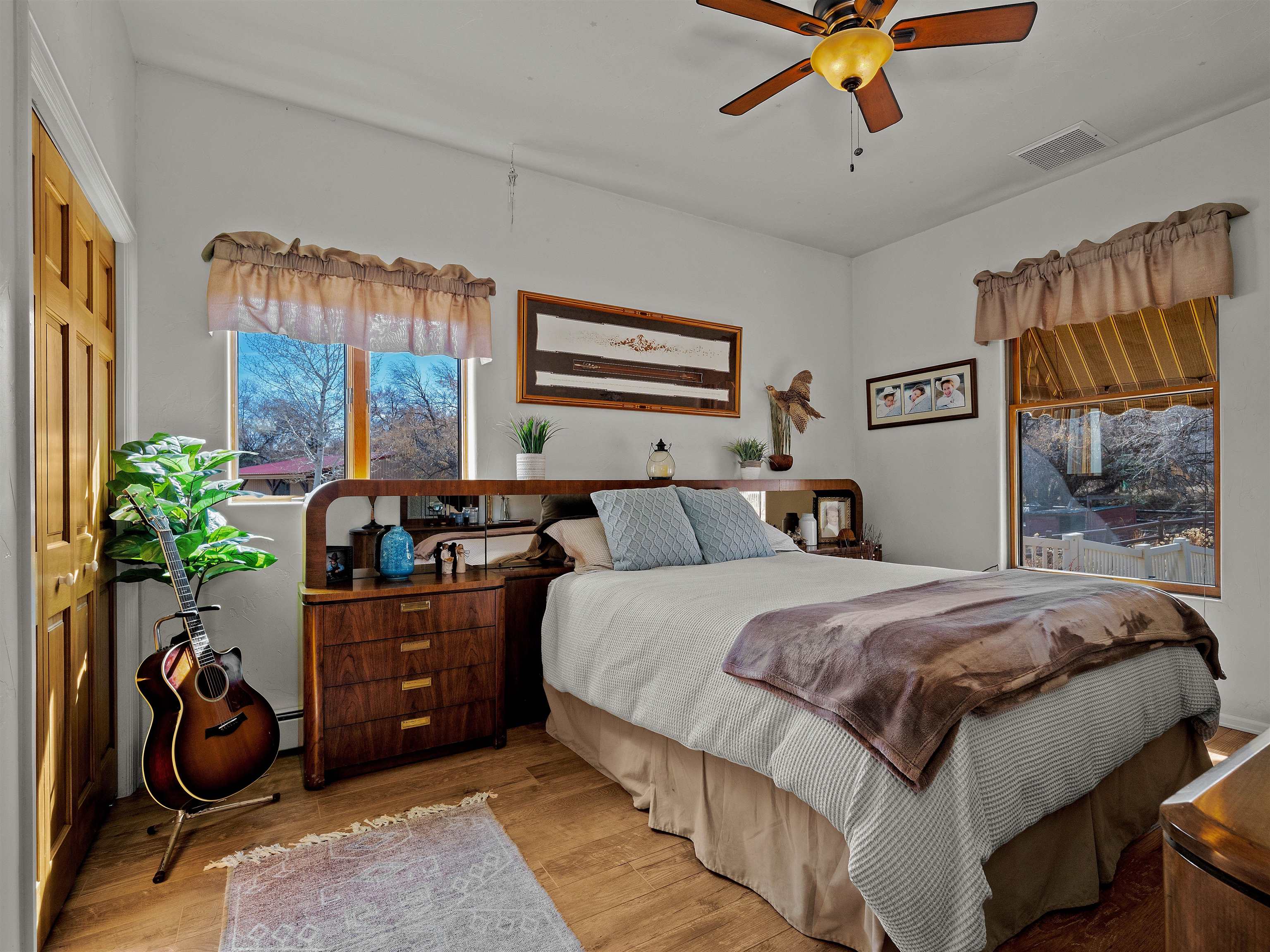 2111 Desert Hill Road Grand Junction, CO 81507 - Photo 24 of 34 a bed room with a bed and a painting on the wall