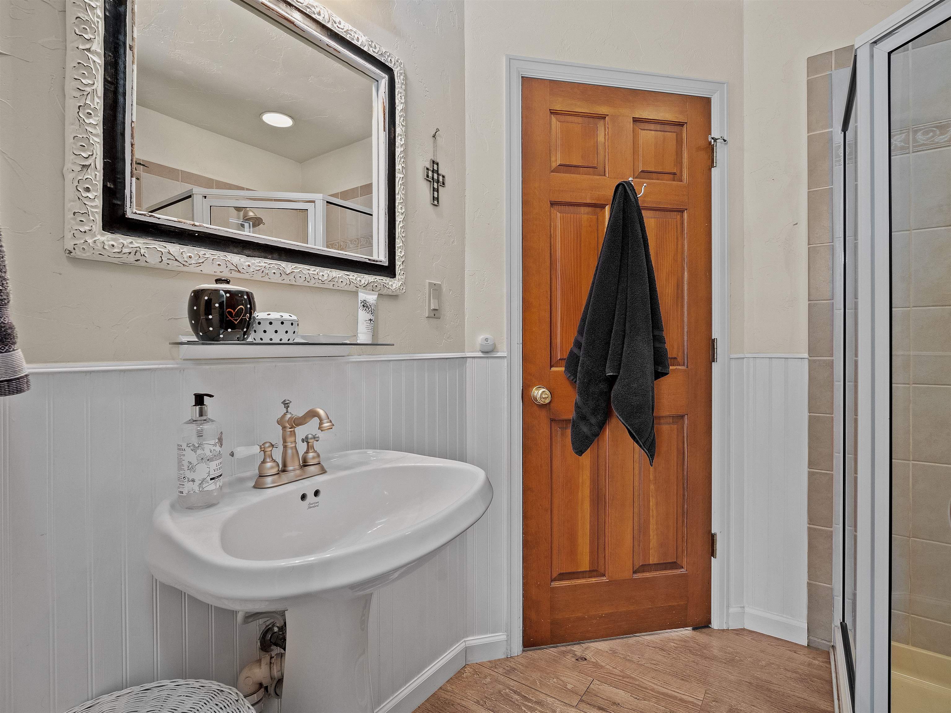 2111 Desert Hill Road Grand Junction, CO 81507 - Photo 25 of 34 a bathroom with a sink and a mirror
