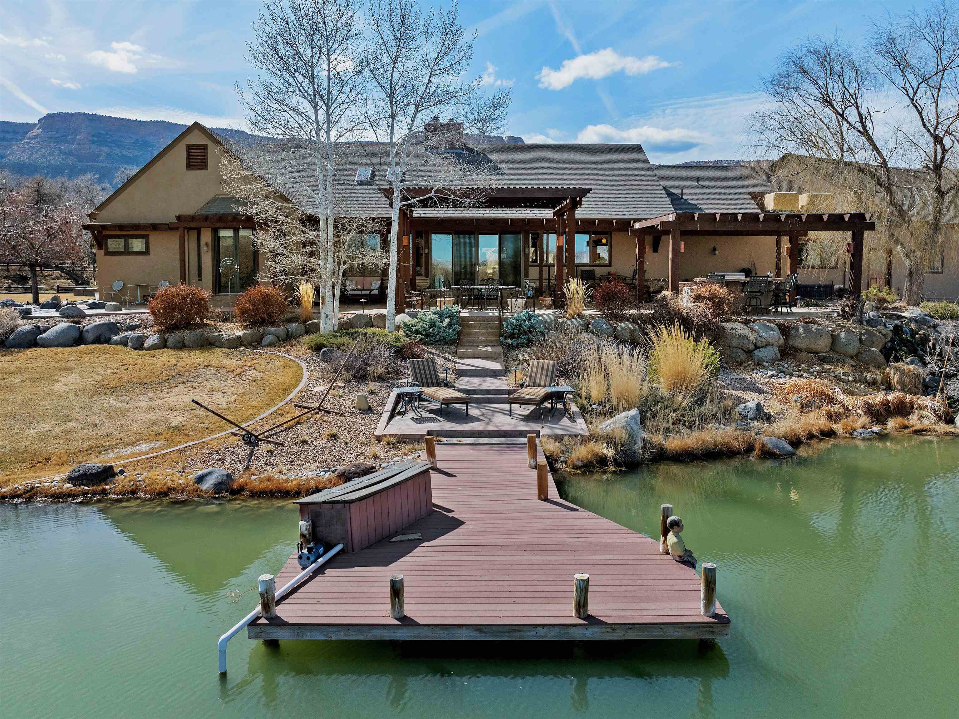 2111 Desert Hill Road Grand Junction, CO 81507 - Photo 30 of 34 a view of a house with swimming pool and sitting area
