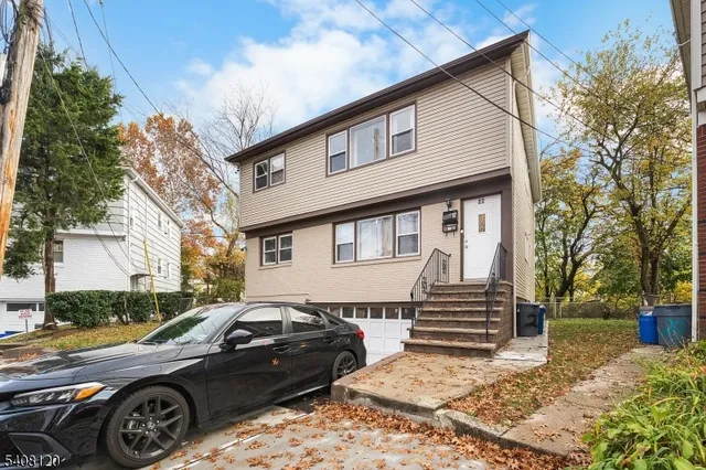 a view of a car parked in front of a house