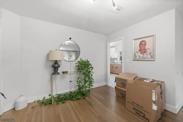 a room with furniture and a wooden floor