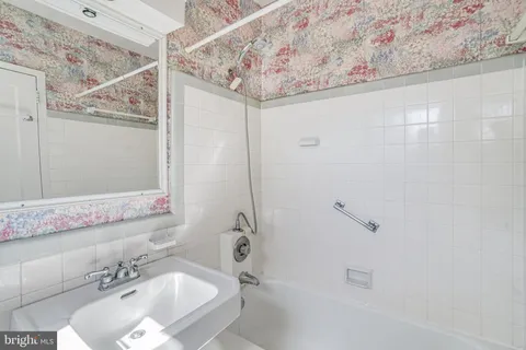a bathroom with a sink and shower