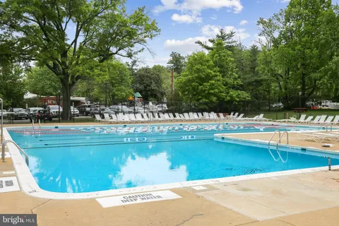 a view of swimming pool with outdoor seating
