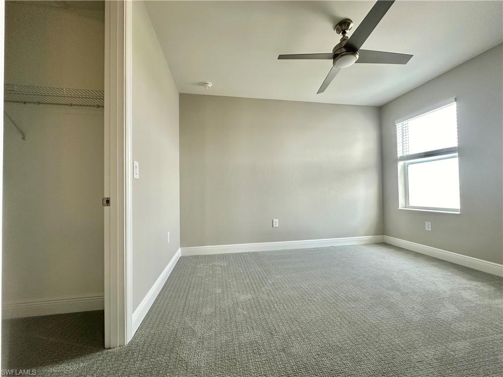 4580 Centaurus Circle Naples, FL 34120 - Photo 13 of 25 Unfurnished bedroom with carpet floors and ceiling fan