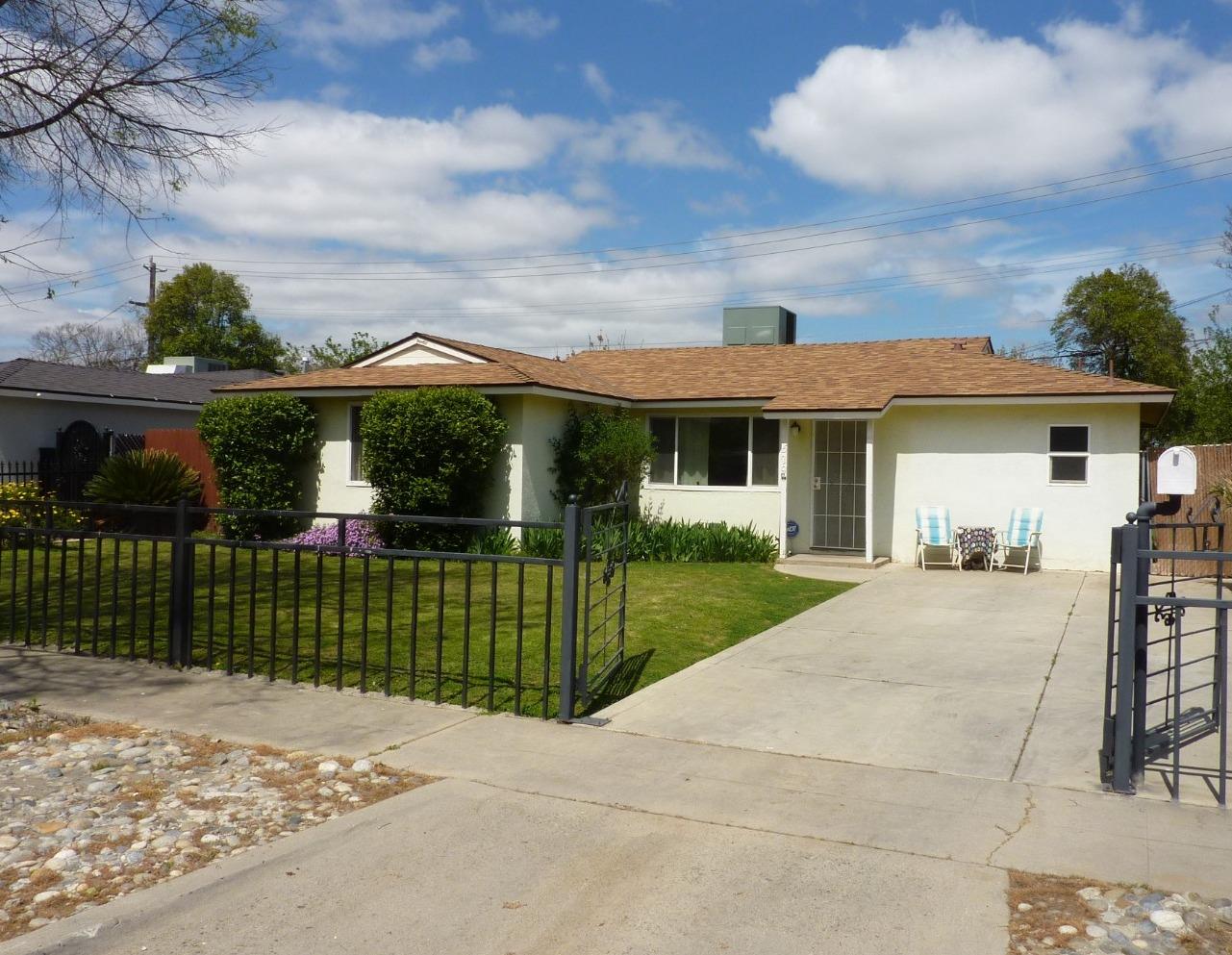 front view of a house with a garden