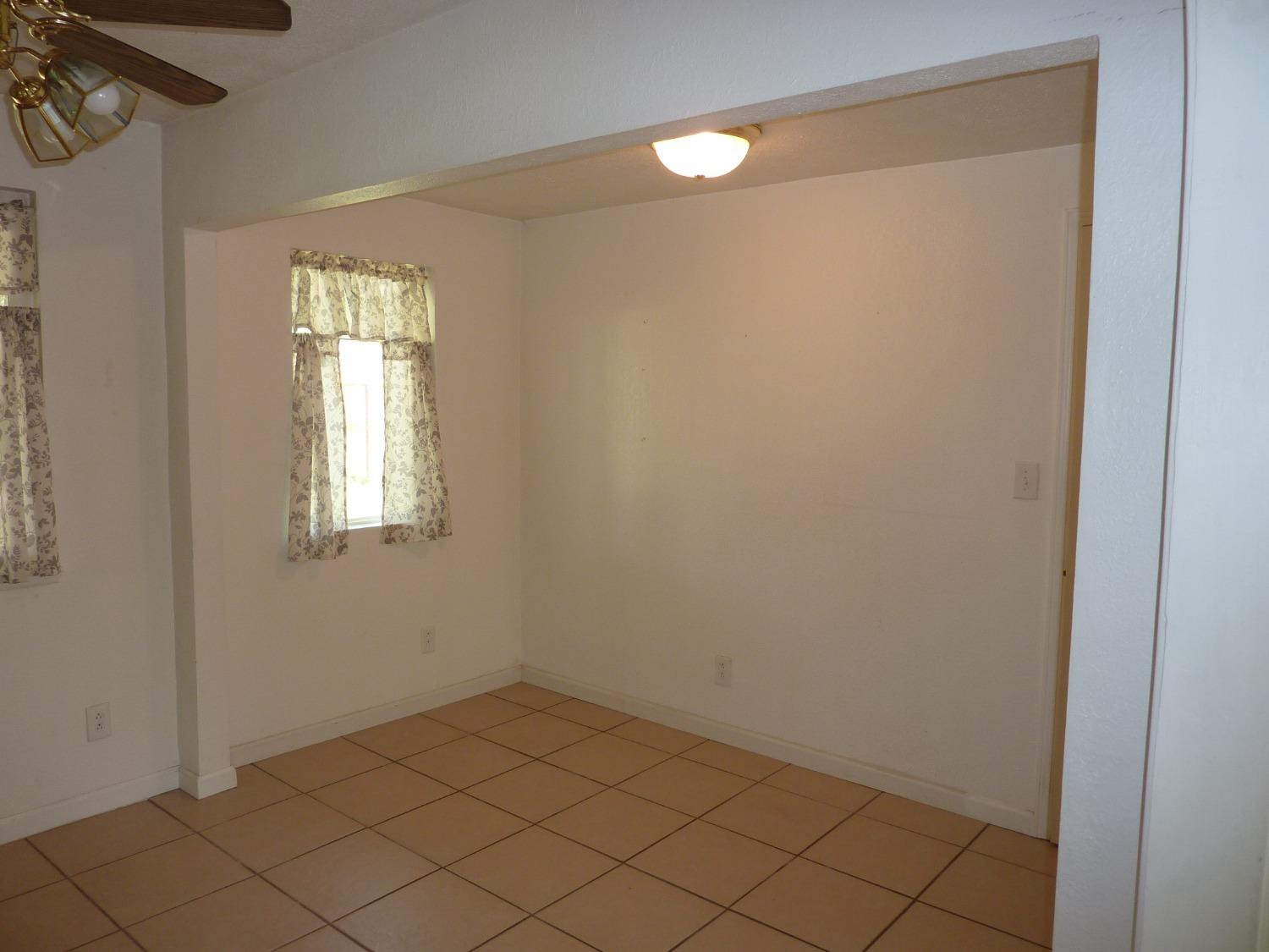 2629 East Richert Avenue Fresno, CA 93726 - Photo 12 of 32 a view of a room that has a window in it