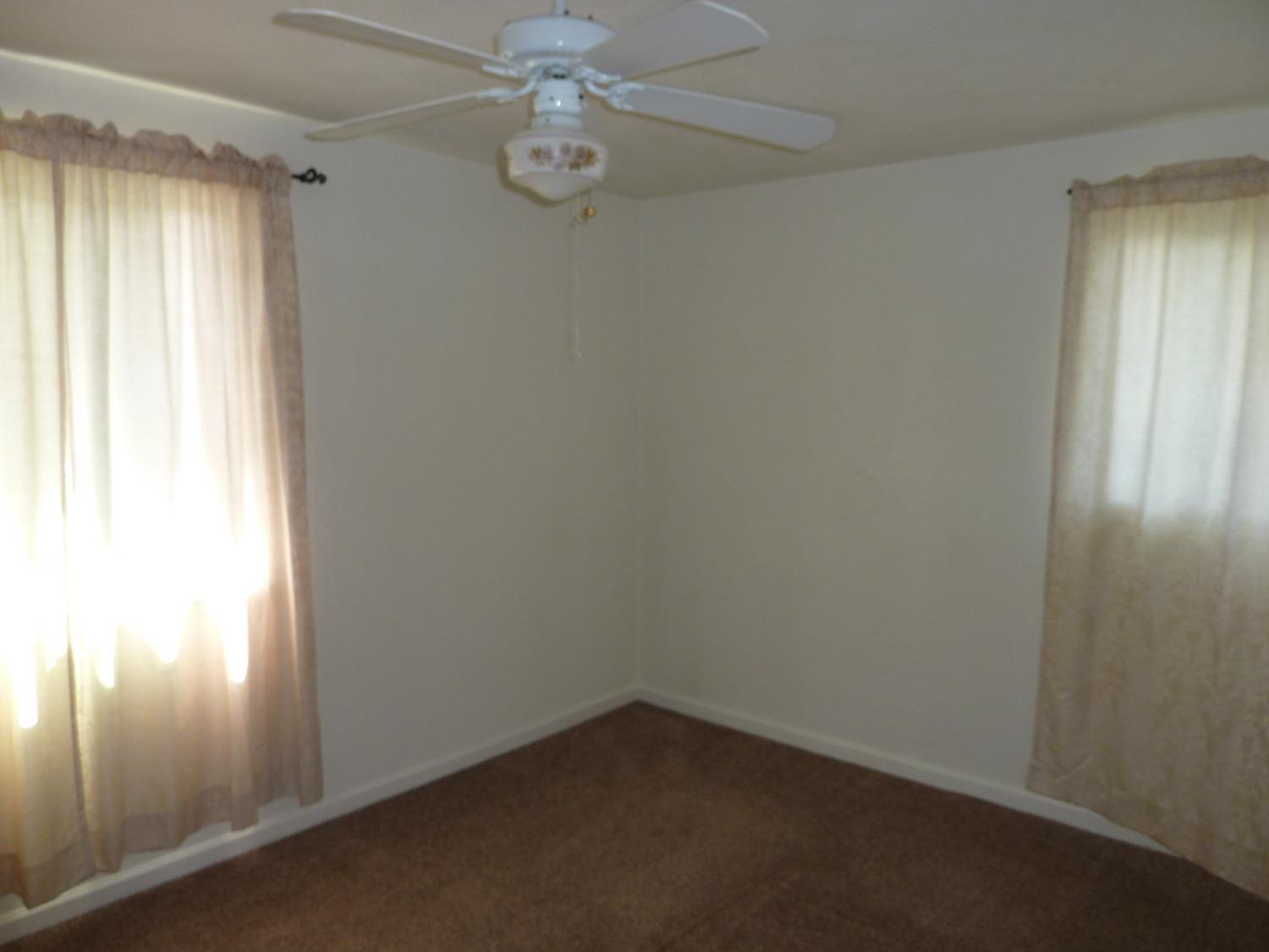 2629 East Richert Avenue Fresno, CA 93726 - Photo 24 of 32 an empty room with a window