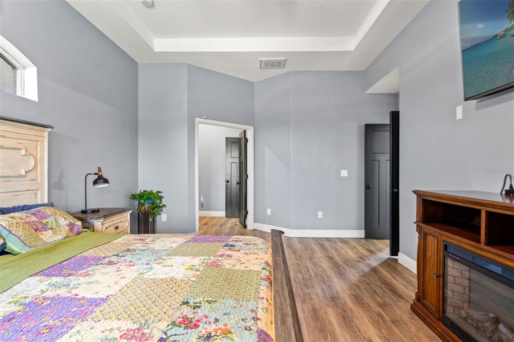 12277 Eskimo Curlew Road Weeki Wachee, FL 34614 - Photo 29 of 84 a bedroom with a bed and a dresser