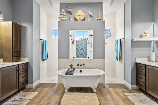 a bedroom with a bed and a mirror