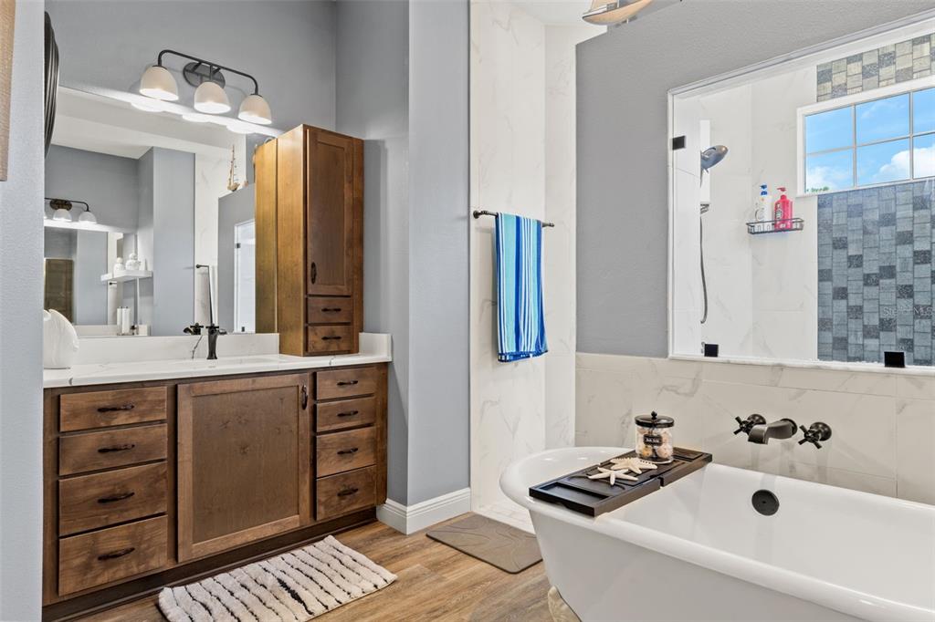 12277 Eskimo Curlew Road Weeki Wachee, FL 34614 - Photo 31 of 84 a bathroom with a sink and a mirror