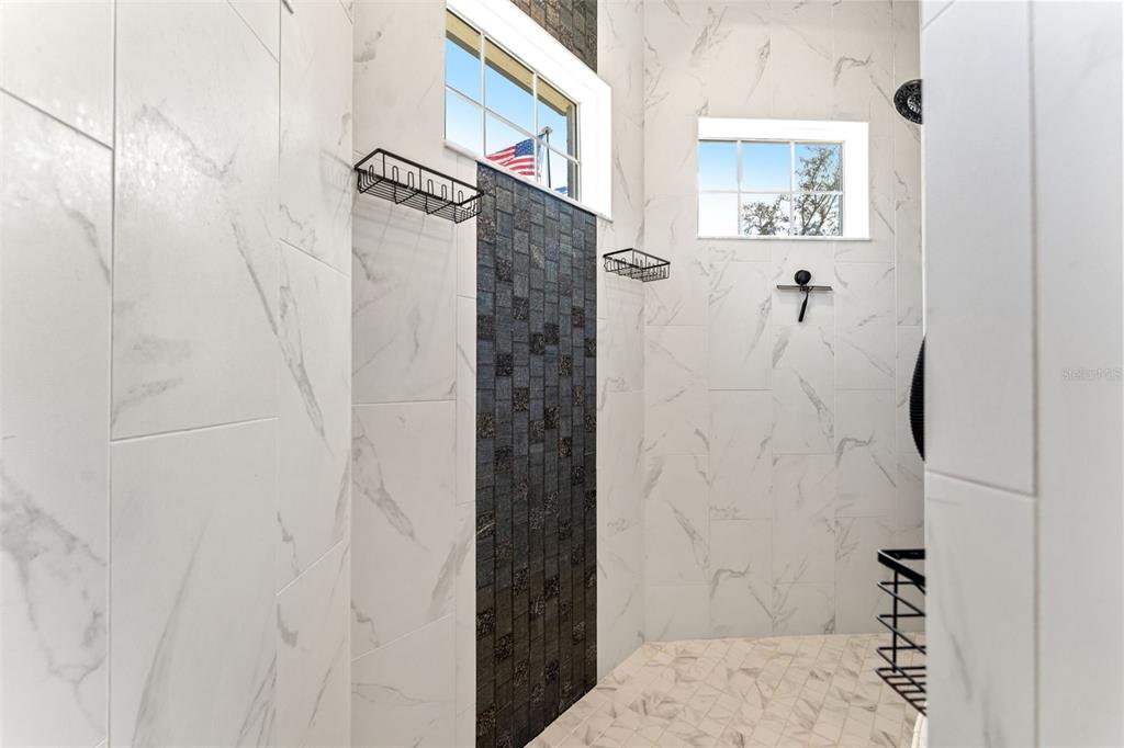 12277 Eskimo Curlew Road Weeki Wachee, FL 34614 - Photo 34 of 84 a bathroom with a shower and a sink