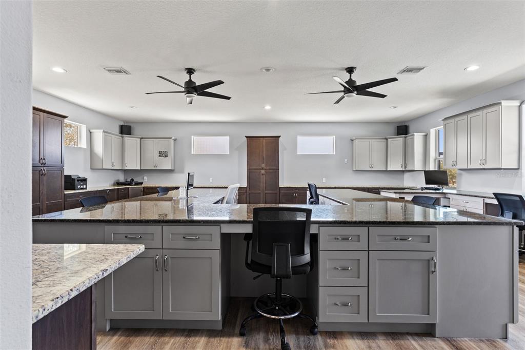 12277 Eskimo Curlew Road Weeki Wachee, FL 34614 - Photo 47 of 84 a kitchen with a sink stove and cabinets