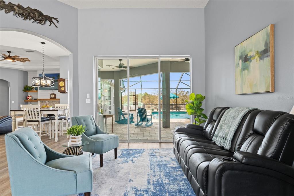 12277 Eskimo Curlew Road Weeki Wachee, FL 34614 - Photo 9 of 84 a living room with furniture and a large window