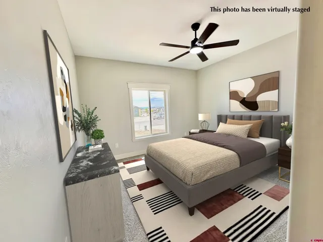 a bedroom with bed and window